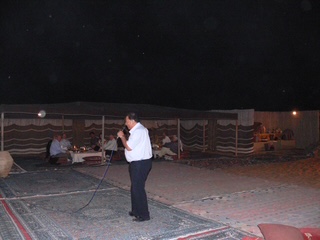 Faisal Hasnain speaking at Al Maha desert event